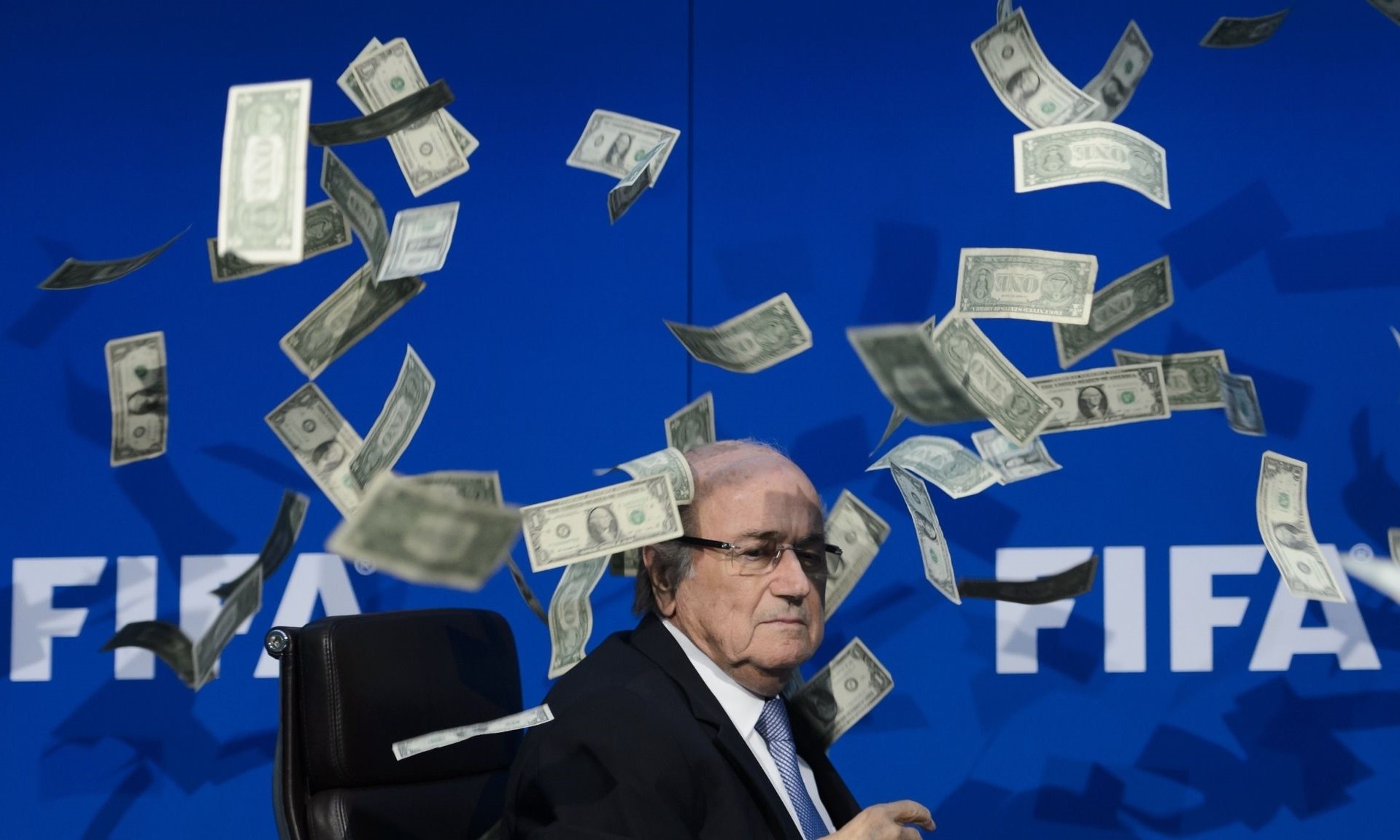 What Is the Prize Money in FIFA World Cup Qatar 2022? FIFA Chief seen sitting and the dollars are raining. Sarcastic theme to mark the award of FIFA World Cup 2022 to Qatar amidst protests