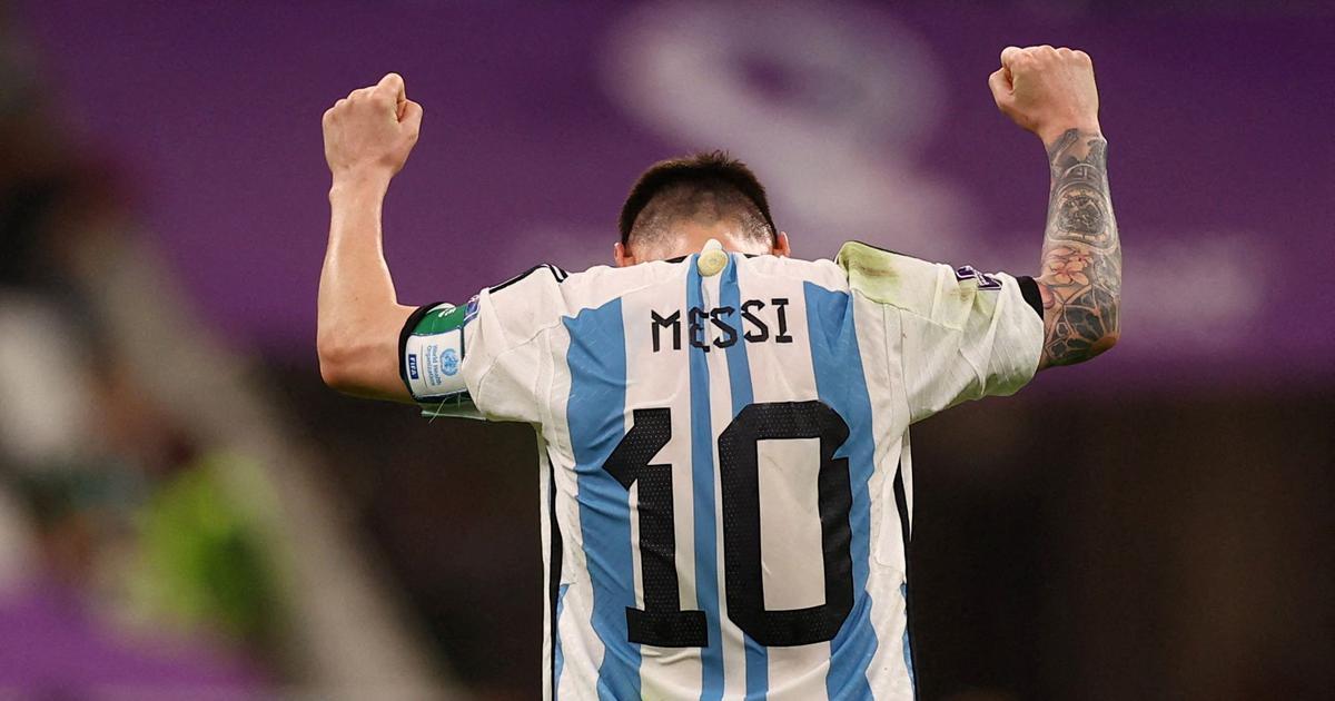 Lionel Messi Confirms Retirement After FIFA World Cup Qatar Final Game.
Lionel Messi standing with his back in front showing his jersey number 10. He is thumping up his hands up in the air, a sign of triumph.