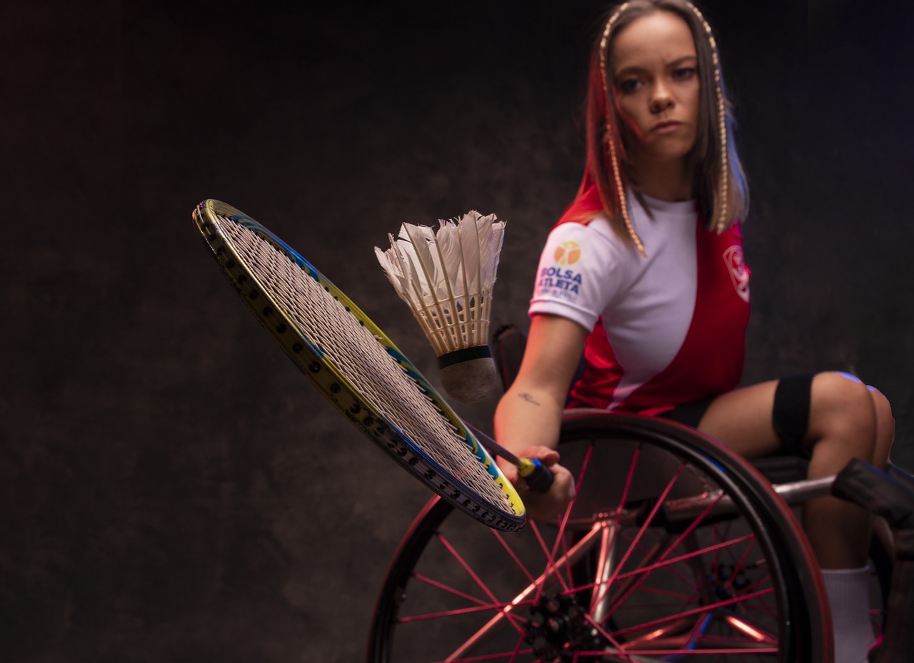 A physically challenged female badminton player in action Empowering Triumph: Unveiling the Inspiring Journey of Paralympic Athletes